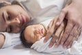 Close up portrait of asian young couple holding their new born baby. Royalty Free Stock Photo